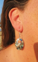 Pierced oval-shaped abalone mother-of-pearl earrings