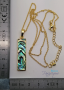 Abalone mother-of-pearl pendant in the shape of a golden stick