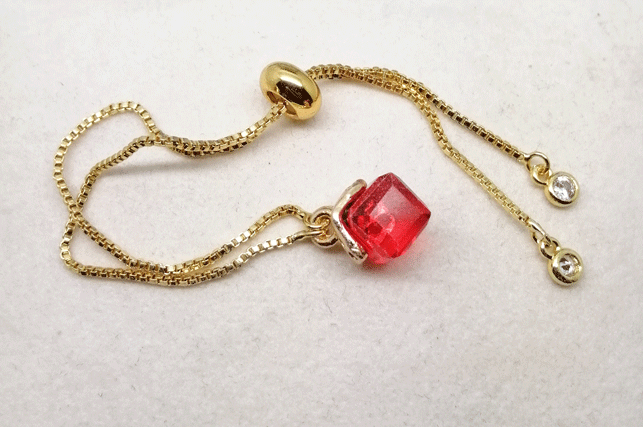 Bracelet with red crystal cube