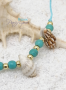 Bracelet corde avec 4 coquillages et perles